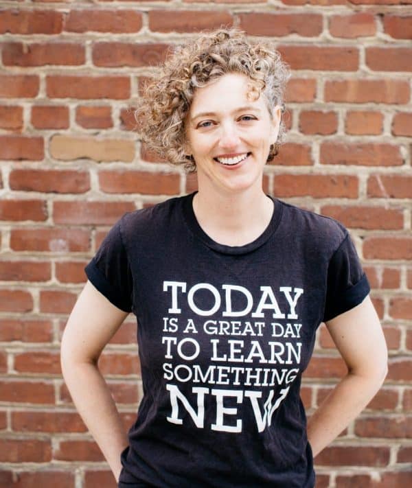 Eva smiling, in a shirt that reads: today is a great day to learn something new.